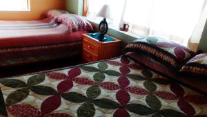 Postel nebo postele na pokoji v ubytování Cabaña en medio del bosque ZA