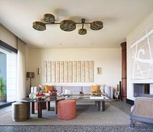 a living room with a table and a couch at Root Redrock Yalıkavak in Yalıkavak