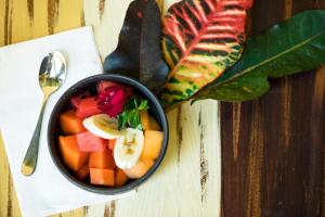a bowl of fruit and vegetables on a table at Casa De Sierra Azul in Oaxaca City