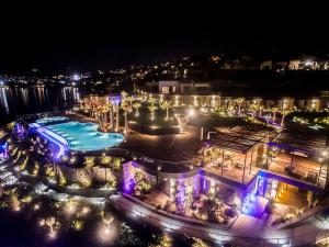 an aerial view of a pool at night at Root Redrock Yalıkavak in Yalıkavak