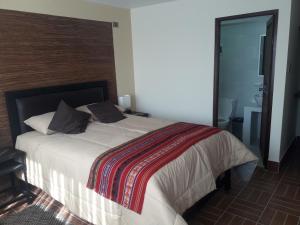 Postel nebo postele na pokoji v ubytování Hostal Jerian