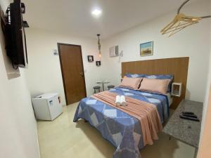 Ένα ή περισσότερα κρεβάτια σε δωμάτιο στο Suites Brisa e Estrela e Gruta