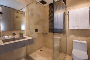 a bathroom with a toilet and a sink and a shower at Oz Hotel Luxury in Cartagena de Indias
