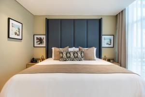 Posteľ alebo postele v izbe v ubytovaní Oz Hotel Luxury