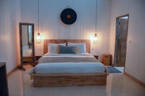 Postel nebo postele na pokoji v ubytování Villa Kayu