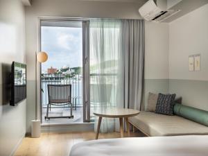 HOTEL ANTEROOM NAHA客房内的一张或多张床位