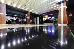 an empty lobby with a bowling alley in a mall at Timor Plaza Hotel & Apartments in Dili