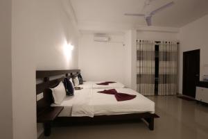 Ліжко або ліжка в номері Lavenro Hotel & Resort