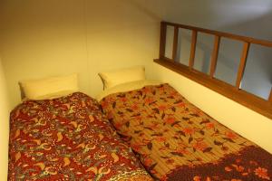 Postel nebo postele na pokoji v ubytování Funky Monkey Lodge, Myoko ファンキーモンキーロッジ 妙高