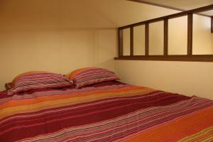 Postel nebo postele na pokoji v ubytování Funky Monkey Lodge, Myoko ファンキーモンキーロッジ 妙高