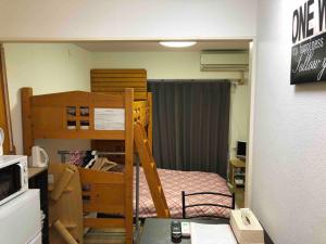 Guest house ZEN HAKATA 102 tesisinde bir ranza yatağı veya ranza yatakları