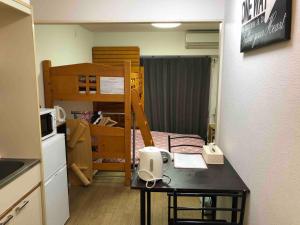 Guest house ZEN HAKATA 102 tesisinde mutfak veya mini mutfak