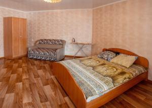 Voodi või voodid majutusasutuse Dekabrist Apartment on Proezzhaya 25 toas