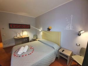 Un pat sau paturi într-o cameră la Resort San Nicola - Restaurant and Wellness Fitness