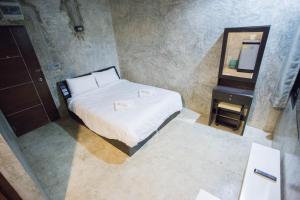 Postel nebo postele na pokoji v ubytování STAY MAYB Chiang Mai