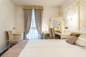 Postelja oz. postelje v sobi nastanitve Hotel Arcangelo 3 stelle Superior