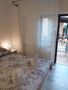 Postel nebo postele na pokoji v ubytování Apartmani Jurman
