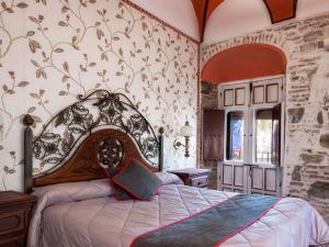 a bedroom with a large bed in a room at Hotel Las Palmeras by Vivere Stays in Zafra
