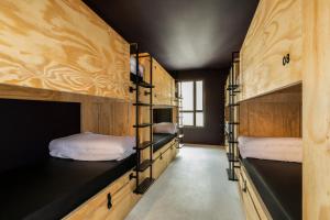 a room with multiple bunk beds in a house at JO&JOE Paris - Nation in Paris