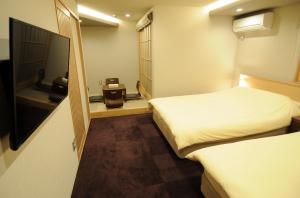 Katil atau katil-katil dalam bilik di HIZ HOTEL Kyoto-Nijo Castle