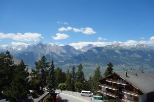 a view of the mountains from a building at Magrappé M 231 - SKI LIFT apartment 6 pers in Veysonnaz +5 photos