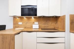 Kuchyňa alebo kuchynka v ubytovaní Kasprowicza 20 Uzdrowisko by Jantar Apartamenty Kołobrzeg
