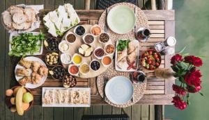a table with a bunch of different types of food at Park Mandalin Hotel - Adult only in Ağva