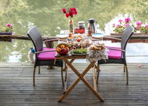 a table with a tray of food on a deck at Park Mandalin Hotel - Adult only in Ağva