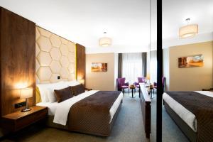 Säng eller sängar i ett rum på Amsterdam Hotel