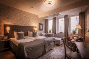Postel nebo postele na pokoji v ubytování Freys Hotel