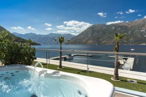 a large body of water with a lake at Blue Kotor Bay Premium Spa Resort in Kotor