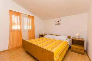 Postel nebo postele na pokoji v ubytování Apartments Manda