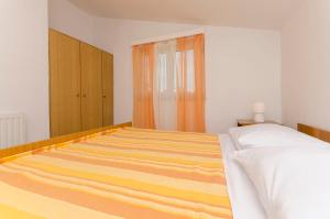 Postel nebo postele na pokoji v ubytování Apartments Manda