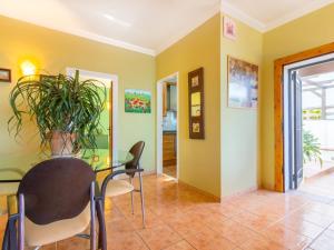 a dining room with a table and chairs at Holiday Home Mila i Fontanals by Interhome in Roses +22 photos