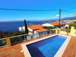 a swimming pool on the balcony of a house at Holiday Home Mila i Fontanals by Interhome in Roses