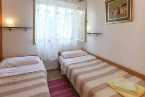 Posteľ alebo postele v izbe v ubytovaní Apartman Mavarcica A4