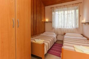 Posteľ alebo postele v izbe v ubytovaní Apartman Mavarcica A4