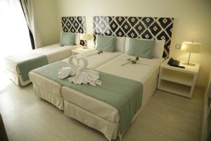Rúm í herbergi á Al Mandari Hôtel Tétouan