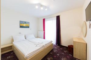 Voodi või voodid majutusasutuse Hotel Jakec Trije kralji na Pohorju toas