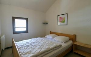 Postel nebo postele na pokoji v ubytování Chalets "les gentianes"