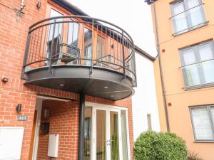 a balcony on the side of a building at 4 Holt Court in Salisbury