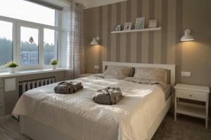 Кровать или кровати в номере ALFA apartment