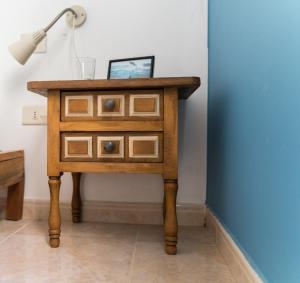 a wooden desk with a lamp and a lamp post at HiTide House in Las Palmas de Gran Canaria