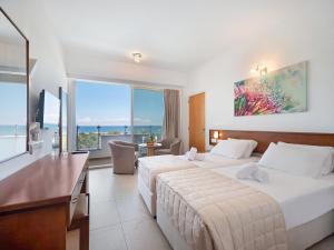 Voodi või voodid majutusasutuse Avlida Hotel toas