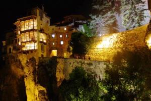 a building on the side of a wall at night at Charming apartment in Cuenca with fireplace - 80 sqm in Cuenca