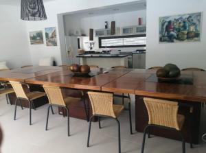 a kitchen with a large wooden table and chairs at finca Dan Pierre in Tocaima
