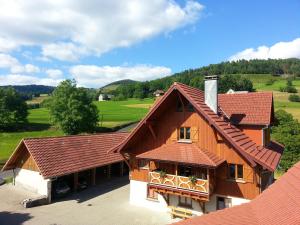 an aerial view of a house with a roof at Appartement chaleureux à Soultzeren avec vue sur montagne in Soultzeren