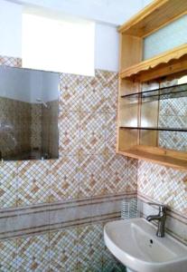 a bathroom with a sink and a mirror at Charming Apartment in Pereybere with Shared Pool, 75 m² in Pereybere +9 photos