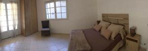 Katil atau katil-katil dalam bilik di Appartement confortable à Pietrosella avec terrasse privée