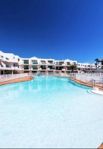 The swimming pool at or close to Studio with shared pool furnished terrace and wifi at Costa Teguise